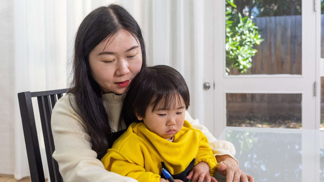 Mother with her child sitting on her lap