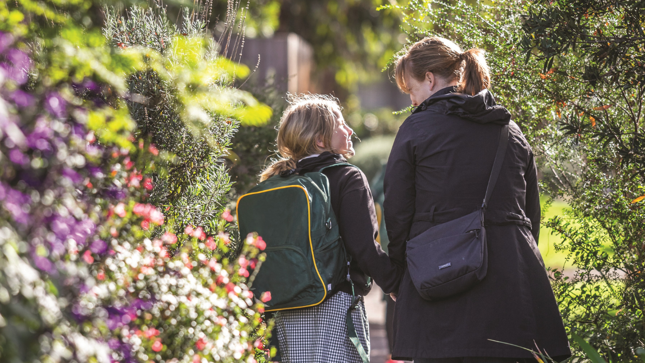 Mother walking her child to school